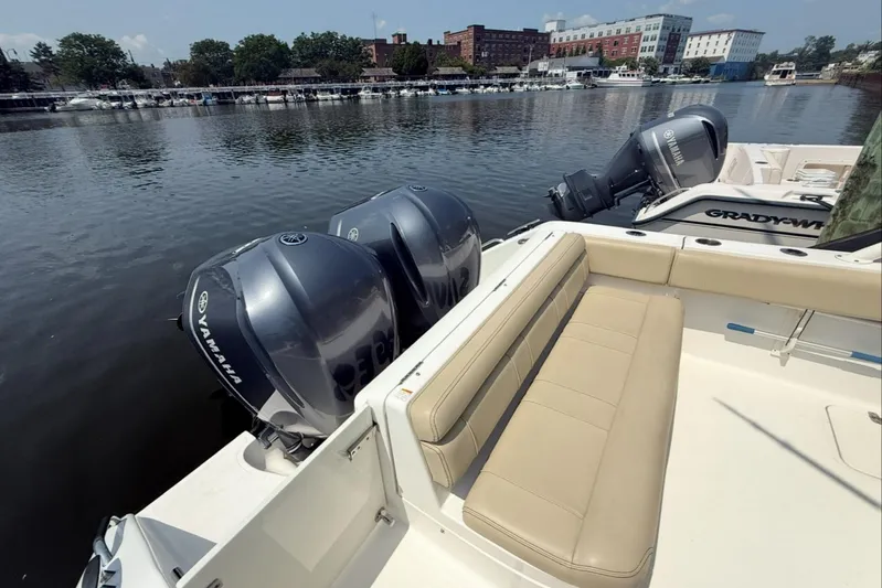 Savages Yacht Photos Pics 2015 Pursuit ST 310 Sport boat with Yamaha engines docked by a riverside.