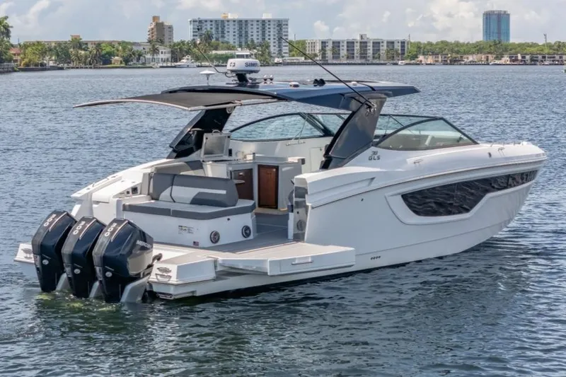  Yacht Photos Pics 2021 Cruisers Yachts 38 GLS on water, featuring triple outboard engines and sleek design.