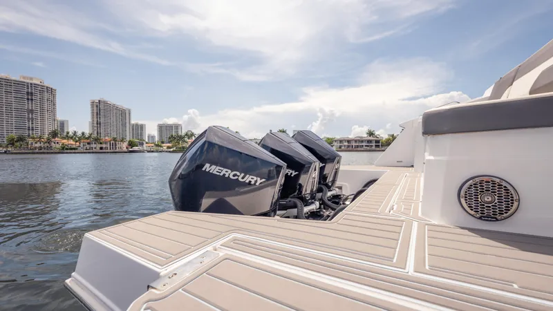  Yacht Photos Pics 2021 Cruisers Yachts 38 GLS with Mercury engines on a sunny waterfront.