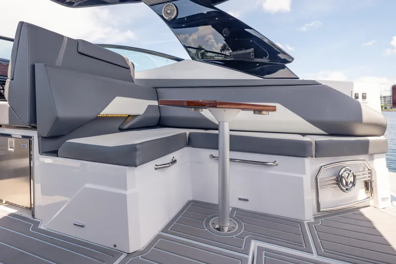  Yacht Photos Pics 2021 Cruisers Yachts 38 GLS interior with sleek seating and modern table design.
