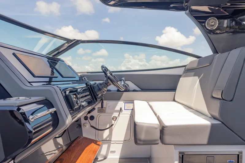  Yacht Photos Pics Interior of 2021 Cruisers Yachts 38 GLS, featuring sleek dashboard and comfortable seating.