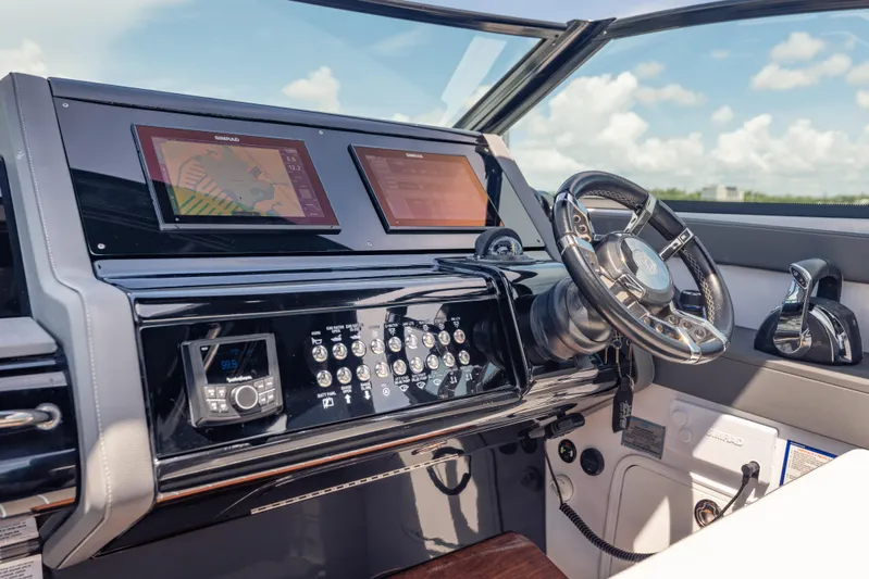  Yacht Photos Pics Helm of 2021 Cruisers Yachts 38 GLS with modern navigation displays and controls.