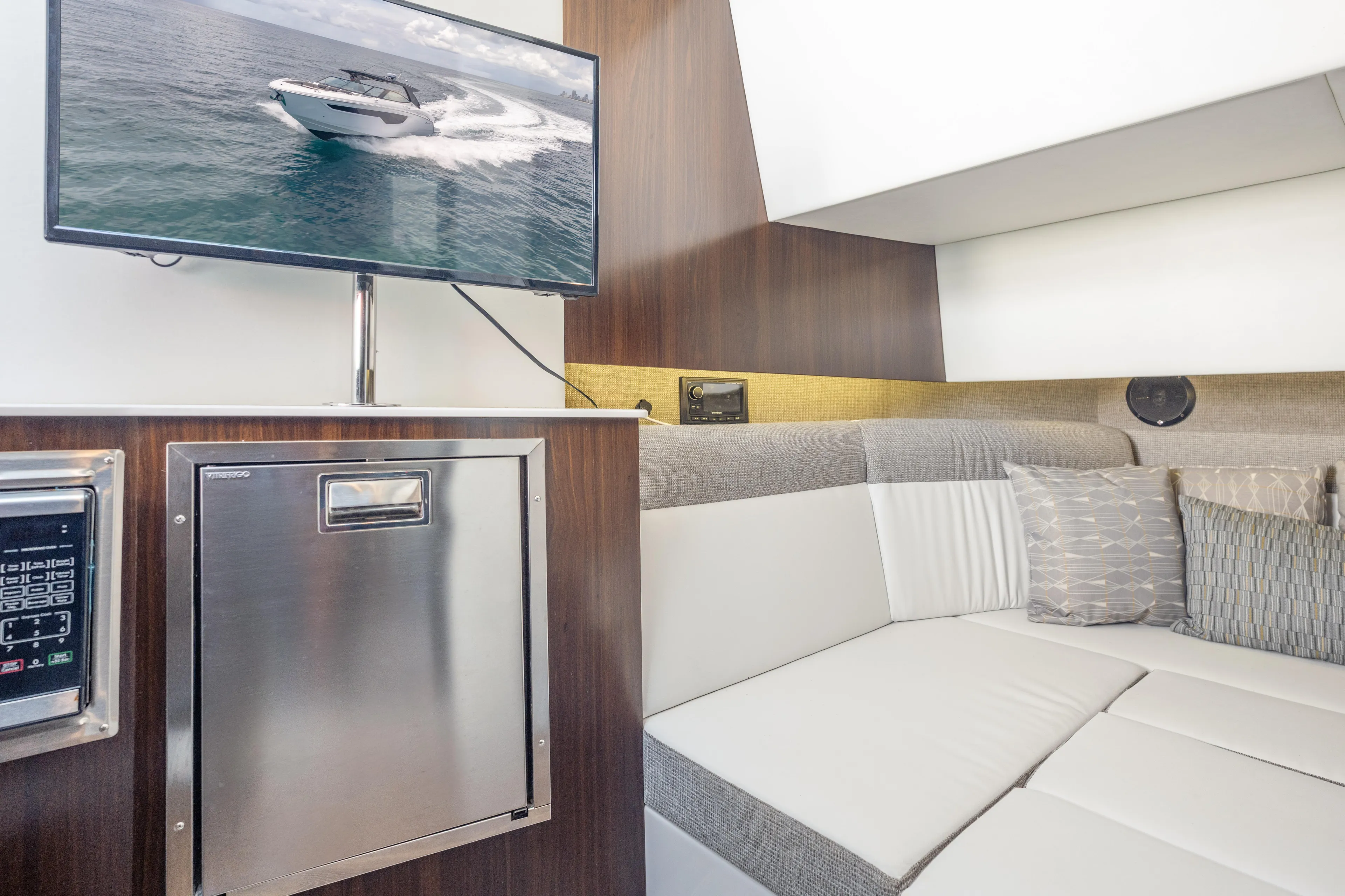  Yacht Photos Pics Interior of 2021 Cruisers Yachts 38 GLS with TV and modern seating area.