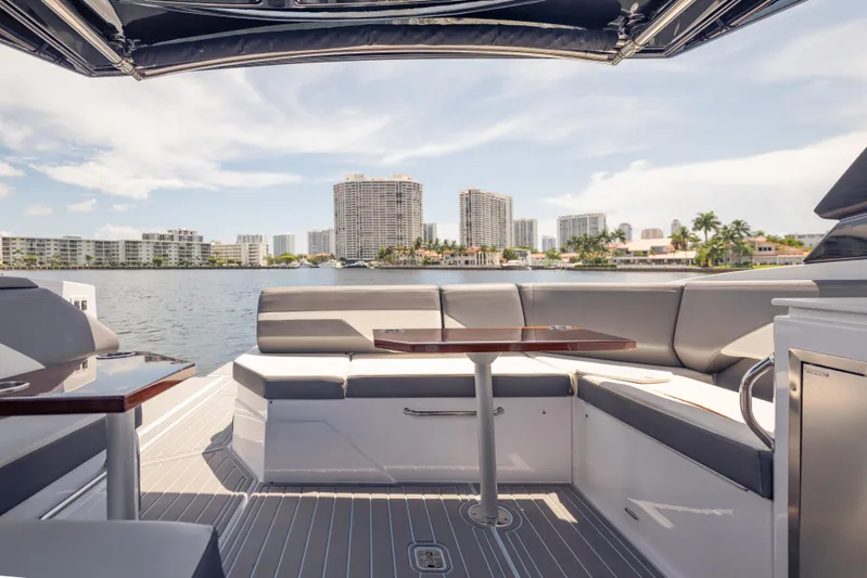  Yacht Photos Pics 2021 Cruisers Yachts 38 GLS interior with waterfront cityscape view.