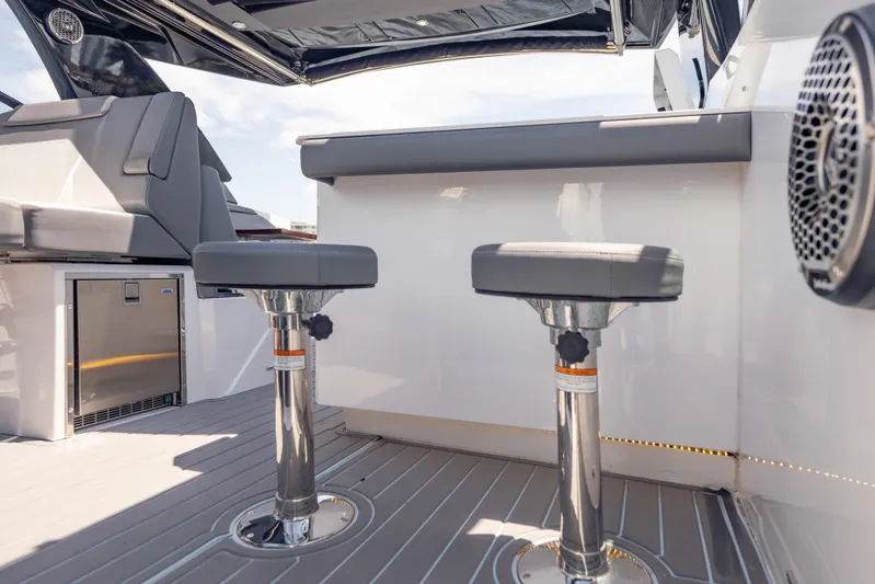  Yacht Photos Pics 2021 Cruisers Yachts 38 GLS interior with modern seating and sleek design elements.