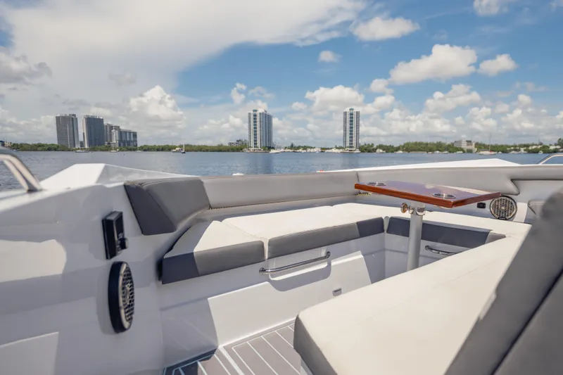  Yacht Photos Pics Luxurious 2021 Cruisers Yachts 38 GLS interior with waterfront cityscape view.