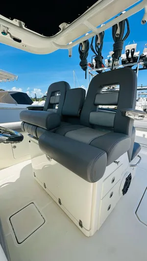  Yacht Photos Pics 2023 Boston Whaler 330 Outrage boat seats with sleek design and modern features.