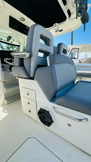  Yacht Photos Pics 2023 Boston Whaler 330 Outrage interior with sleek seating and modern design.