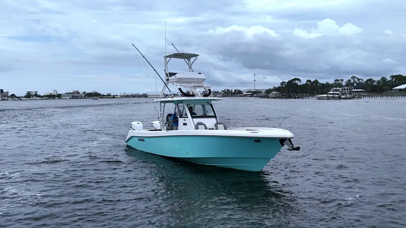 Engine Warranty Yacht Photos Pics 2023 Everglades 365 CC boat on open water under cloudy sky.