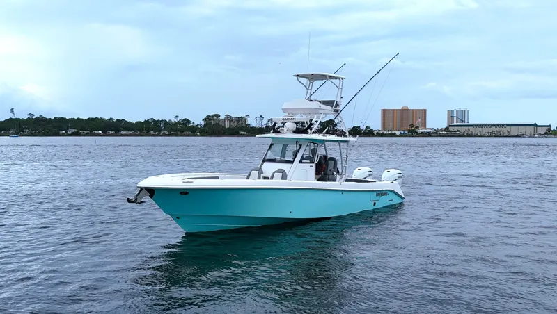 Engine Warranty Yacht Photos Pics 2023 Everglades 365 CC boat on calm water with cityscape background.