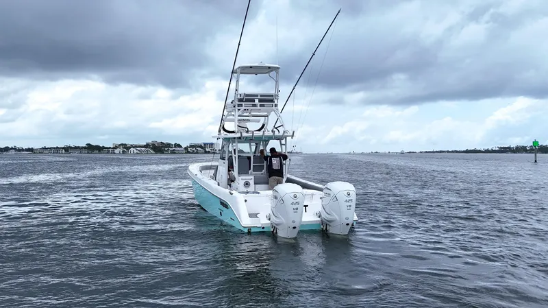 Engine Warranty Yacht Photos Pics 2023 Everglades 365 CC boat on water with dual engines, cloudy sky.