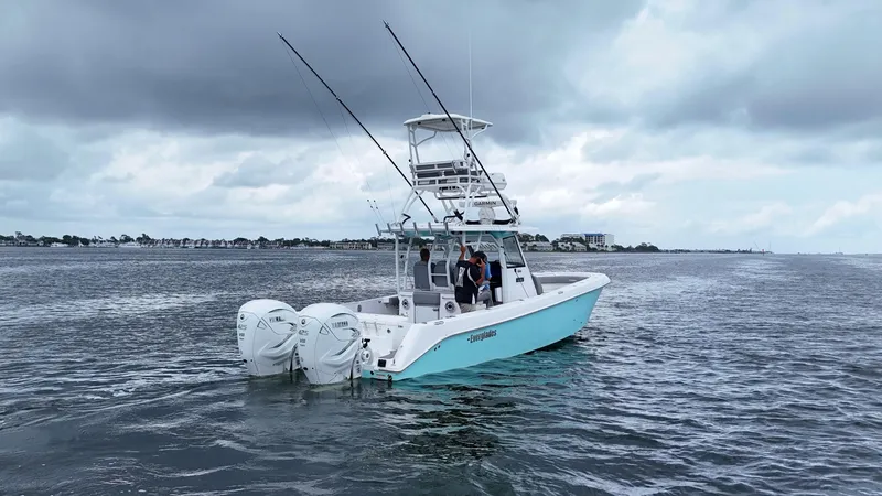 Engine Warranty Yacht Photos Pics 2023 Everglades 365 CC boat on water under cloudy sky.