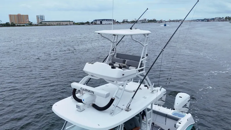Engine Warranty Yacht Photos Pics 2023 Everglades 365 CC boat with fishing rods and Garmin equipment on open water.