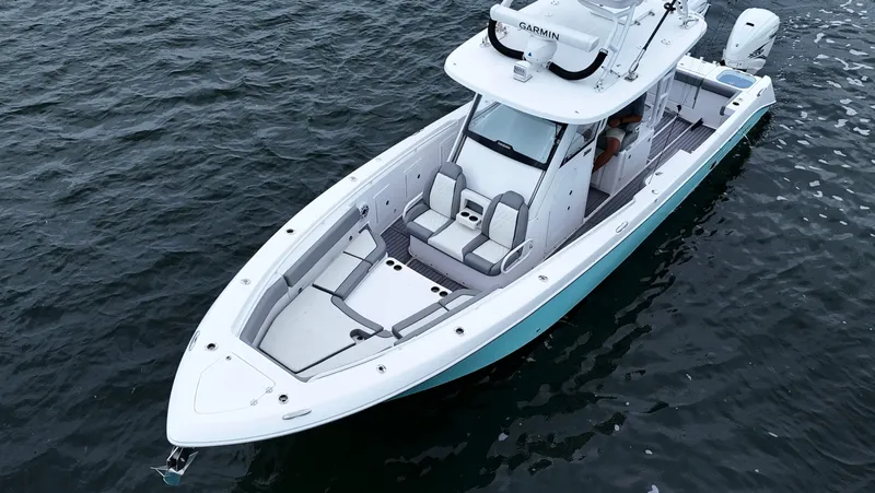 Engine Warranty Yacht Photos Pics 2023 Everglades 365 CC boat on water, aerial view.