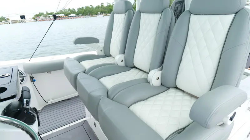 Engine Warranty Yacht Photos Pics Luxurious seating on 2023 Everglades 365 CC boat, featuring quilted upholstery and armrests.