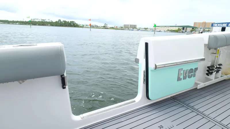 Engine Warranty Yacht Photos Pics 2023 Everglades 365 CC boat with open side door on calm water.