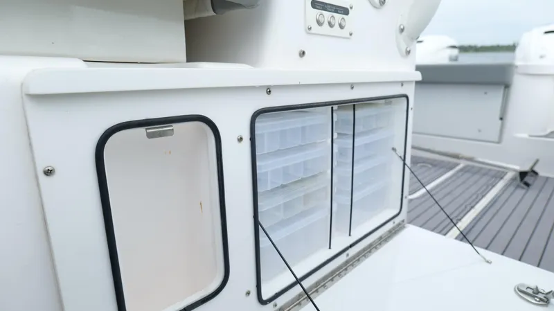 Engine Warranty Yacht Photos Pics Storage compartments on a 2023 Everglades 365 CC boat deck.
