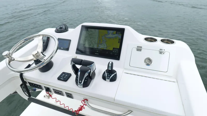 Engine Warranty Yacht Photos Pics 2023 Everglades 365 CC boat helm with navigation system and controls on water.