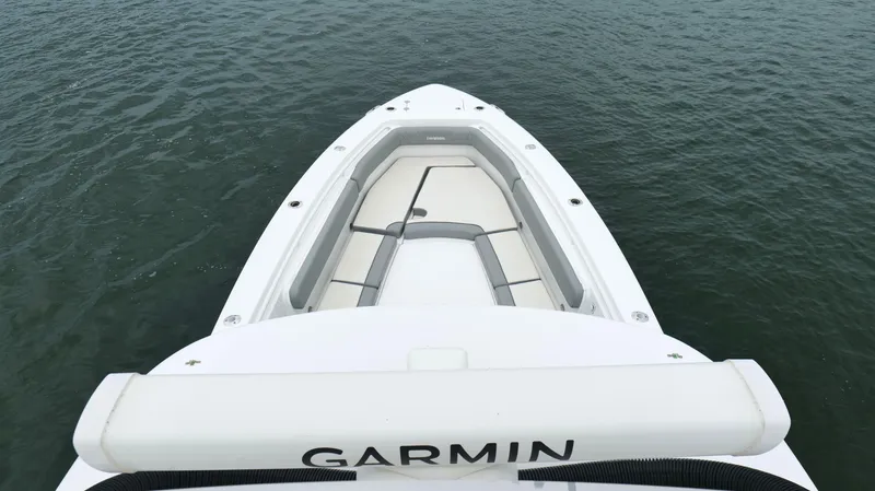 Engine Warranty Yacht Photos Pics 2023 Everglades 365 CC boat bow with seating, on calm water.