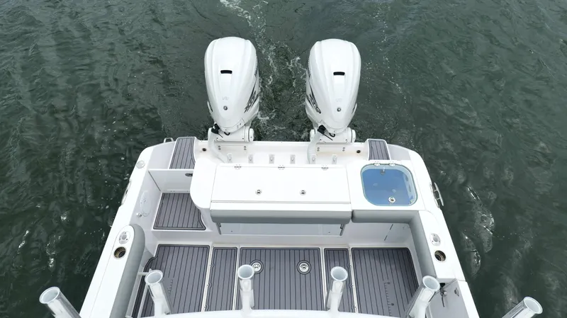 Engine Warranty Yacht Photos Pics 2023 Everglades 365 CC boat with dual engines on water.