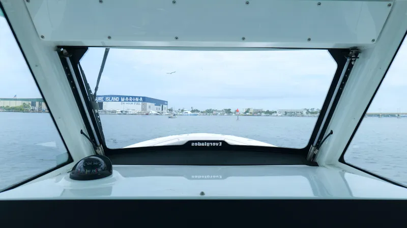 Engine Warranty Yacht Photos Pics View from 2023 Everglades 365 CC boat cockpit, overlooking marina and waterway.