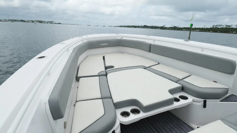 Engine Warranty Yacht Photos Pics 2023 Everglades 365 CC boat with spacious seating on a calm water backdrop.