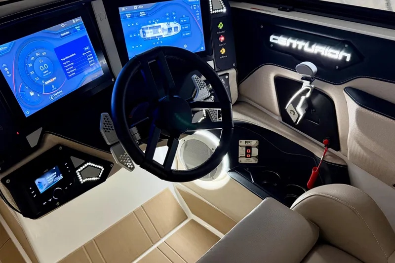  Yacht Photos Pics Interior of 2025 Centurion Ri245 boat with advanced digital dashboard and steering wheel.