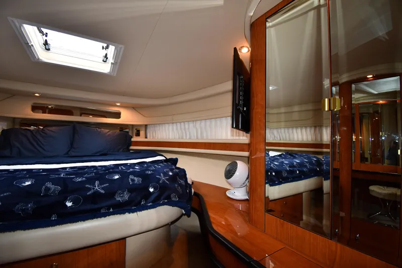  Yacht Photos Pics Luxurious cabin interior of 2000 Sea Ray 460 Sundancer yacht with elegant wood finishes.