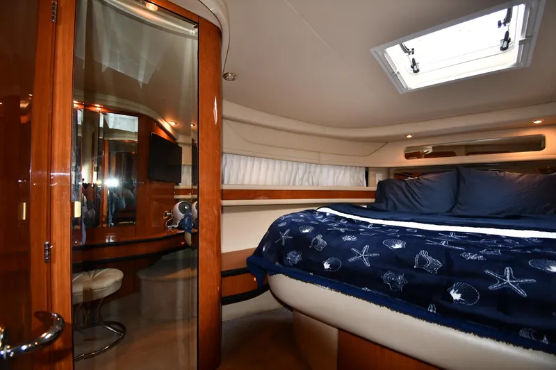  Yacht Photos Pics Luxurious cabin interior of 2000 Sea Ray 460 Sundancer yacht with plush bedding.