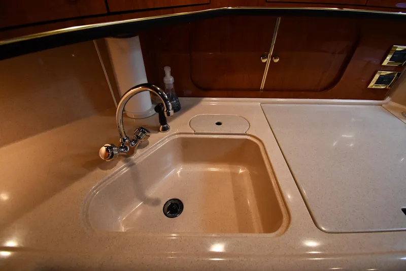  Yacht Photos Pics Luxurious kitchen sink area in 2000 Sea Ray 460 Sundancer yacht.