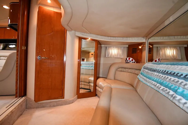  Yacht Photos Pics Luxurious interior of 2000 Sea Ray 460 Sundancer yacht with plush seating and elegant wood finishes.