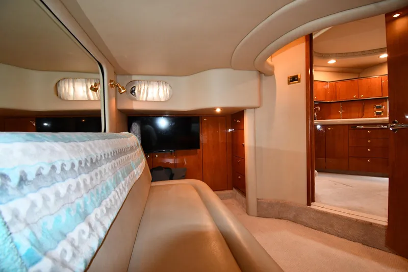  Yacht Photos Pics Interior of 2000 Sea Ray 460 Sundancer yacht, featuring luxurious seating and wooden cabinetry.