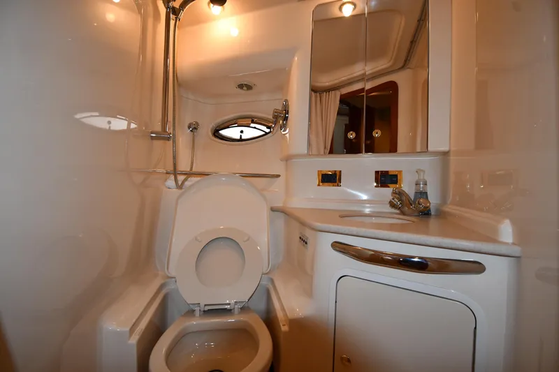  Yacht Photos Pics Bathroom interior of 2000 Sea Ray 460 Sundancer yacht, featuring toilet and sink.