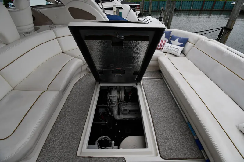  Yacht Photos Pics Open engine compartment on 2000 Sea Ray 460 Sundancer yacht with white seating.