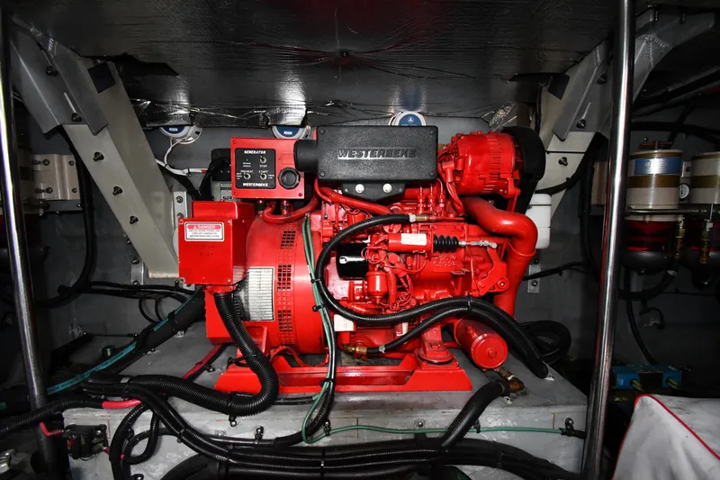  Yacht Photos Pics Engine room of 2000 Sea Ray 460 Sundancer with red Westerbeke generator.