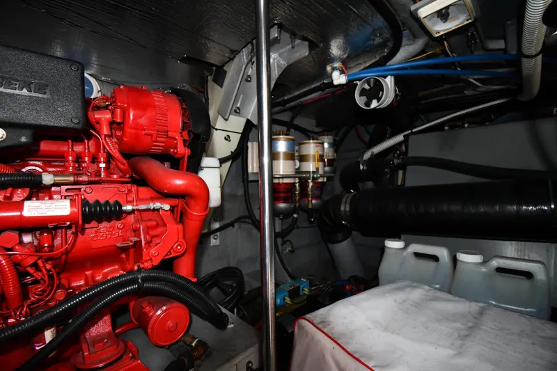  Yacht Photos Pics Engine room of 2000 Sea Ray 460 Sundancer with red engine components and fuel filters.
