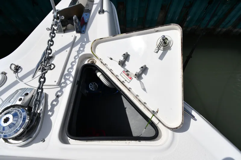  Yacht Photos Pics Open anchor hatch on 2000 Sea Ray 460 Sundancer boat, showing chain and winch.