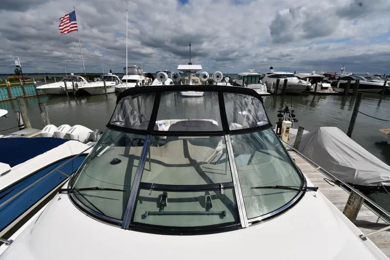  Yacht Photos Pics 2000 Sea Ray 460 Sundancer yacht docked at marina under cloudy sky.