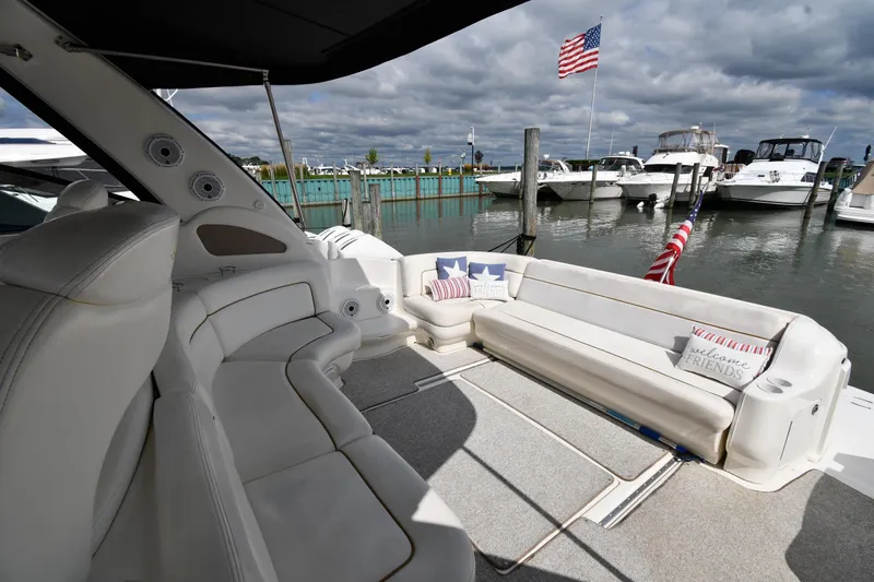  Yacht Photos Pics Luxurious 2000 Sea Ray 460 Sundancer yacht interior with comfortable seating and American flag.