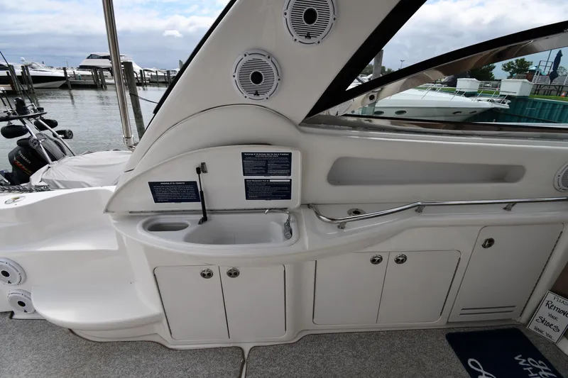  Yacht Photos Pics Interior view of a 2000 Sea Ray 460 Sundancer yacht with sink and storage cabinets.