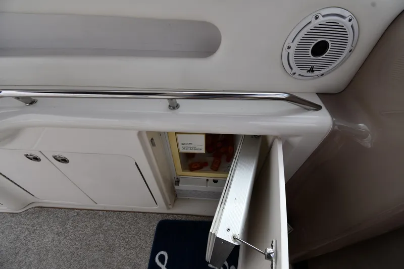  Yacht Photos Pics Interior view of a 2000 Sea Ray 460 Sundancer yacht with open storage compartment.