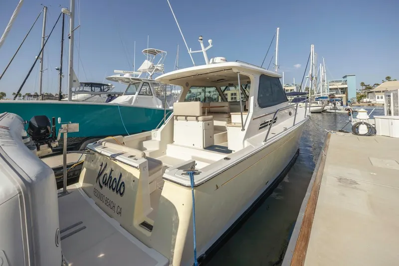 Kaholo Yacht Photos Pics 2008 Back Cove 33 boat docked at marina, featuring spacious deck and sleek design.