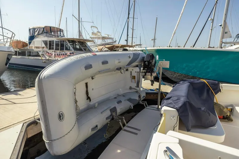 Kaholo Yacht Photos Pics 2008 Back Cove 33 yacht with inflatable dinghy at marina, surrounded by sailboats.