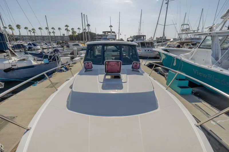 Kaholo Yacht Photos Pics 2008 Back Cove 33 boat docked at a marina, surrounded by other vessels.
