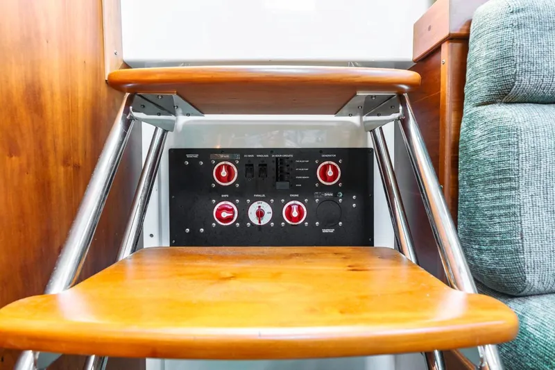 Kaholo Yacht Photos Pics 2008 Back Cove 33 yacht interior with wooden steps and control panel.