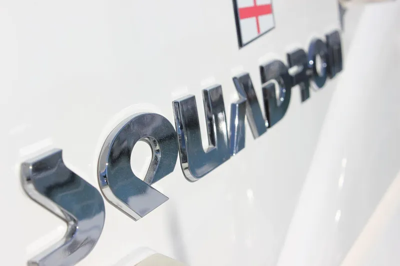 M/y Oneiro Yacht Photos Pics Fairline Squadron 58 yacht emblem, 2008 model, featuring chrome lettering and flag detail.