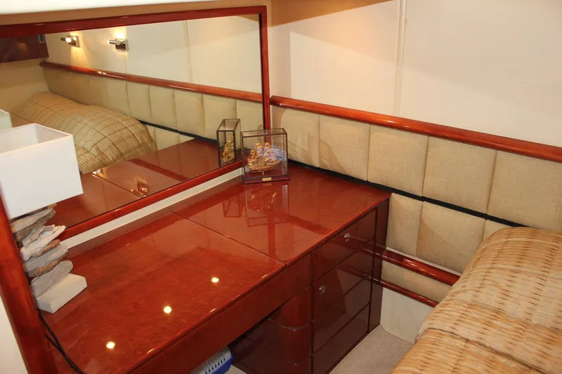 M/y Oneiro Yacht Photos Pics Luxurious interior of 2008 Fairline 58 yacht with elegant wood finish and mirror.