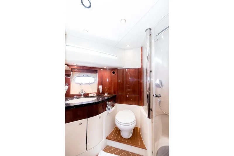 M/y Oneiro Yacht Photos Pics Luxurious 2008 Fairline 58 yacht bathroom with modern fixtures and elegant wood accents.