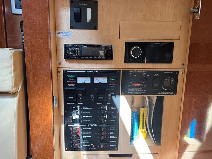  Yacht Photos Pics Control panel of a 2009 Sea Ray 330 Sundancer boat with various switches and gauges.