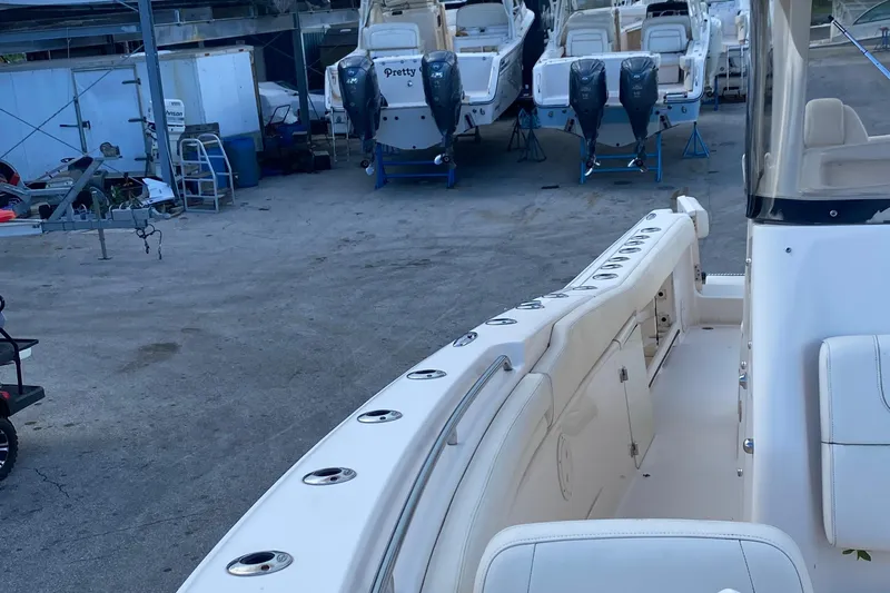  Yacht Photos Pics 2018 Grady-White Canyon 306 boat interior with multiple rod holders and seating.